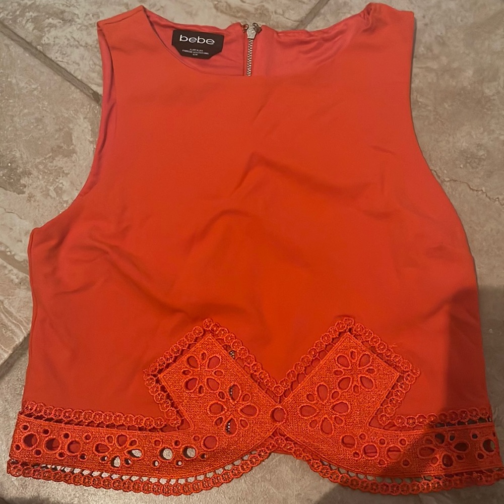 Bright orange Bebe cropped shirt with beautiful design